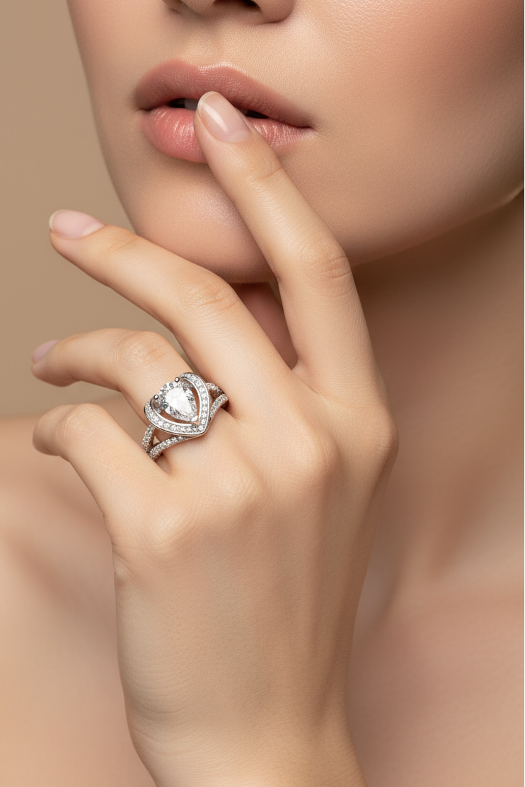 Close-up of a hand wearing a diamond ring with a soft background