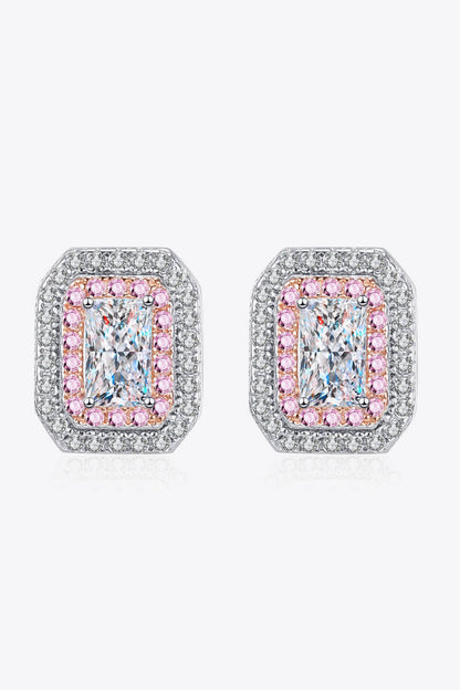 Pair of earrings with pink and clear gemstones on a white background