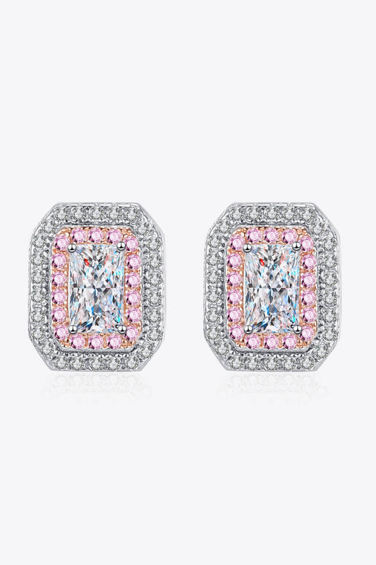 Pair of earrings with pink and clear gemstones on a white background