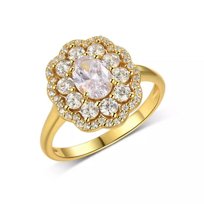 Gold ring with a central diamond and smaller stones on a white background