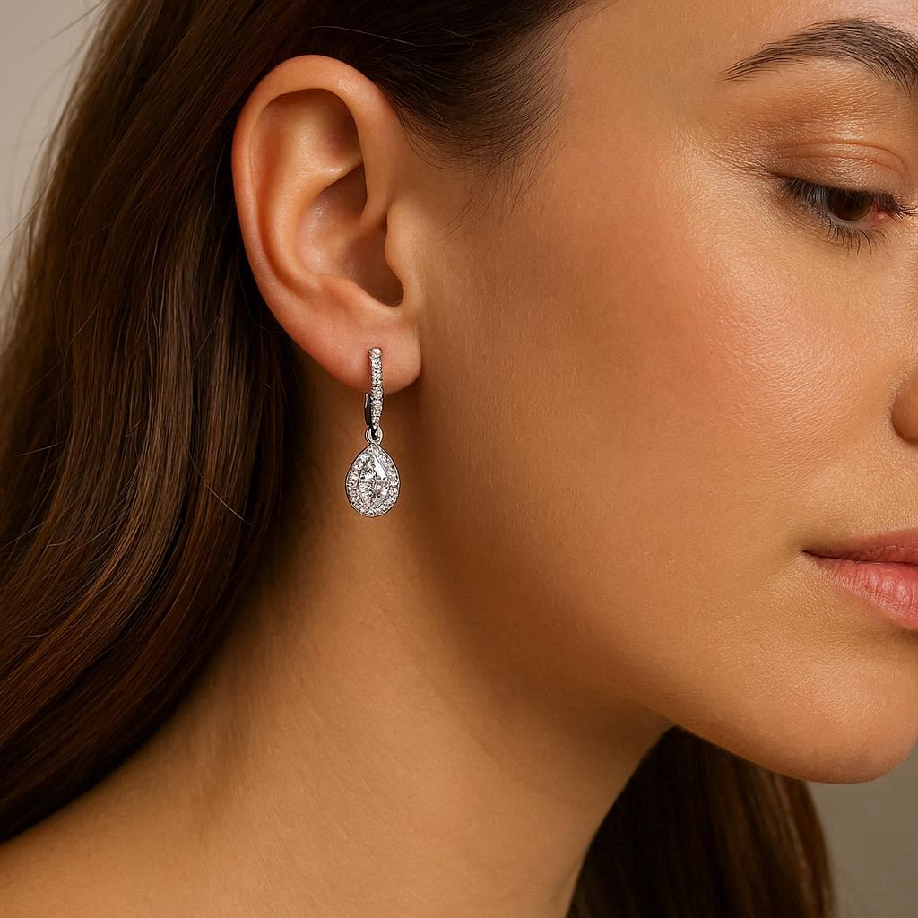 a diamond earring with a neutral background
