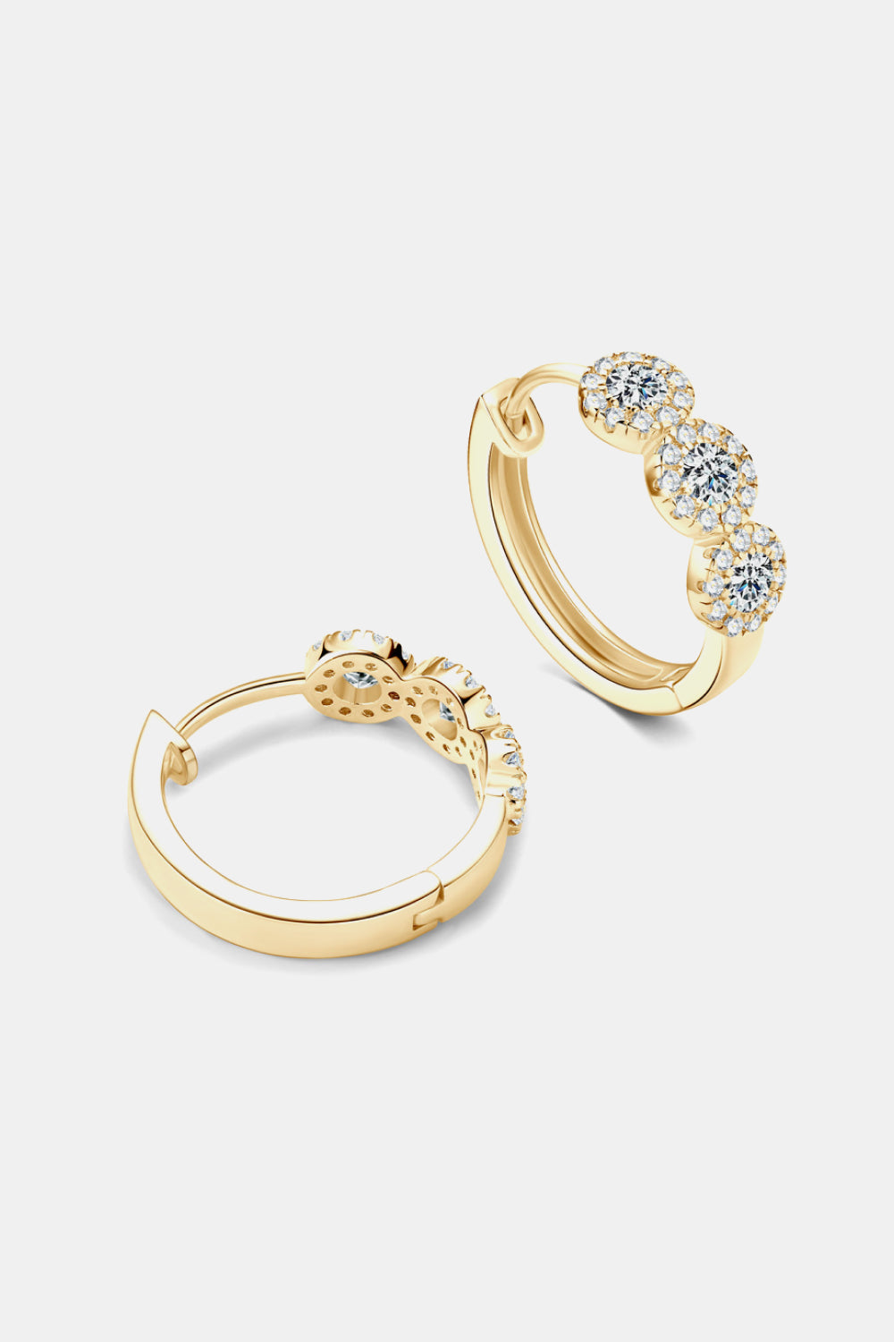 Gold hoop earrings with embedded stones on a light gray background