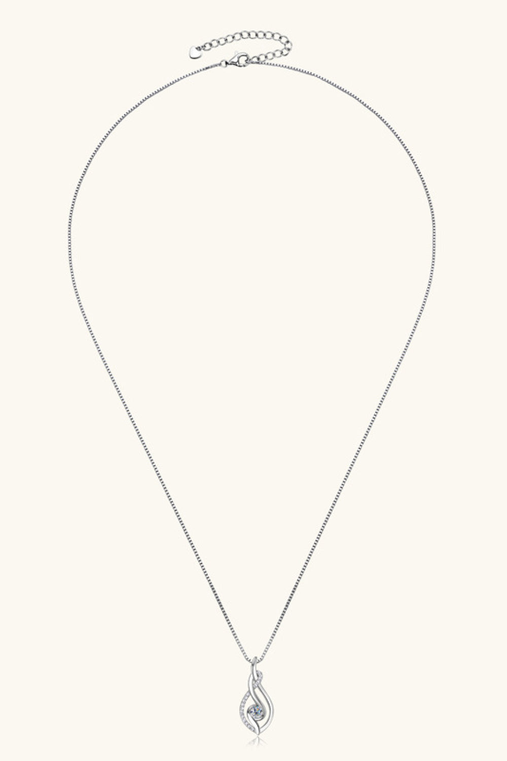 Silver necklace with a teardrop pendant on a white background