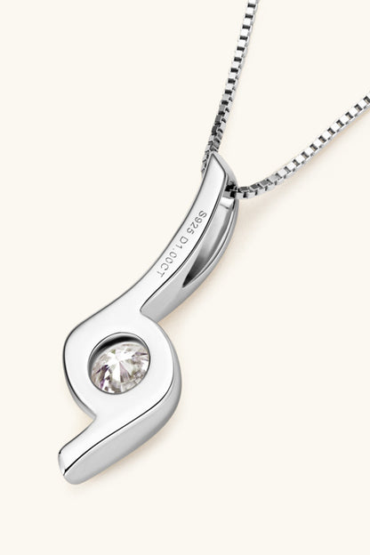Silver pendant with a clear gemstone on a white background