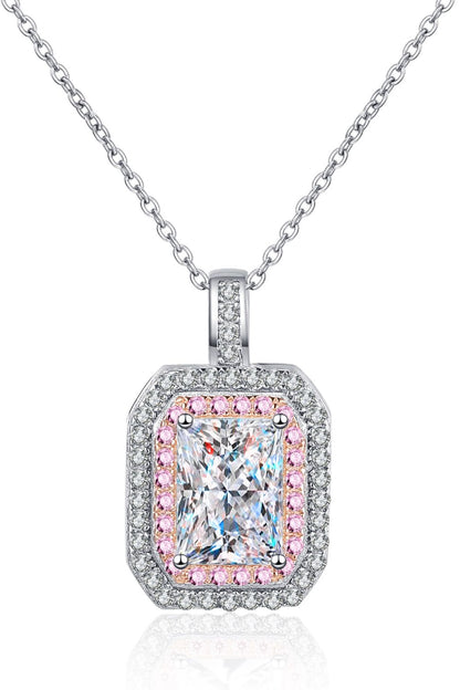 Diamond pendant with pink accents on a white background