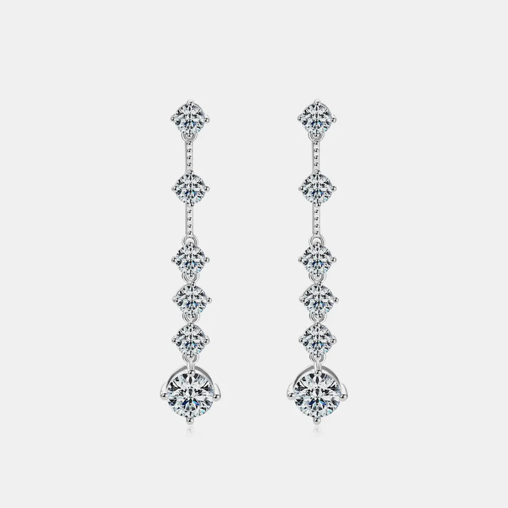 Pair of diamond earrings on a light gray background