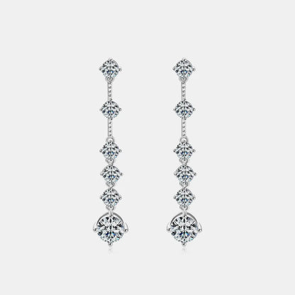 Pair of diamond earrings on a light gray background