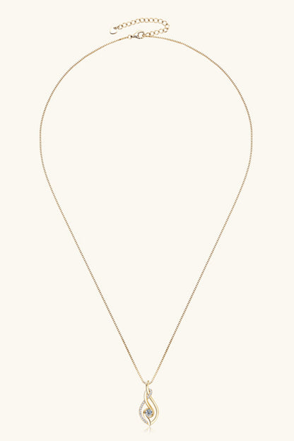 Gold necklace with a delicate pendant on a white background