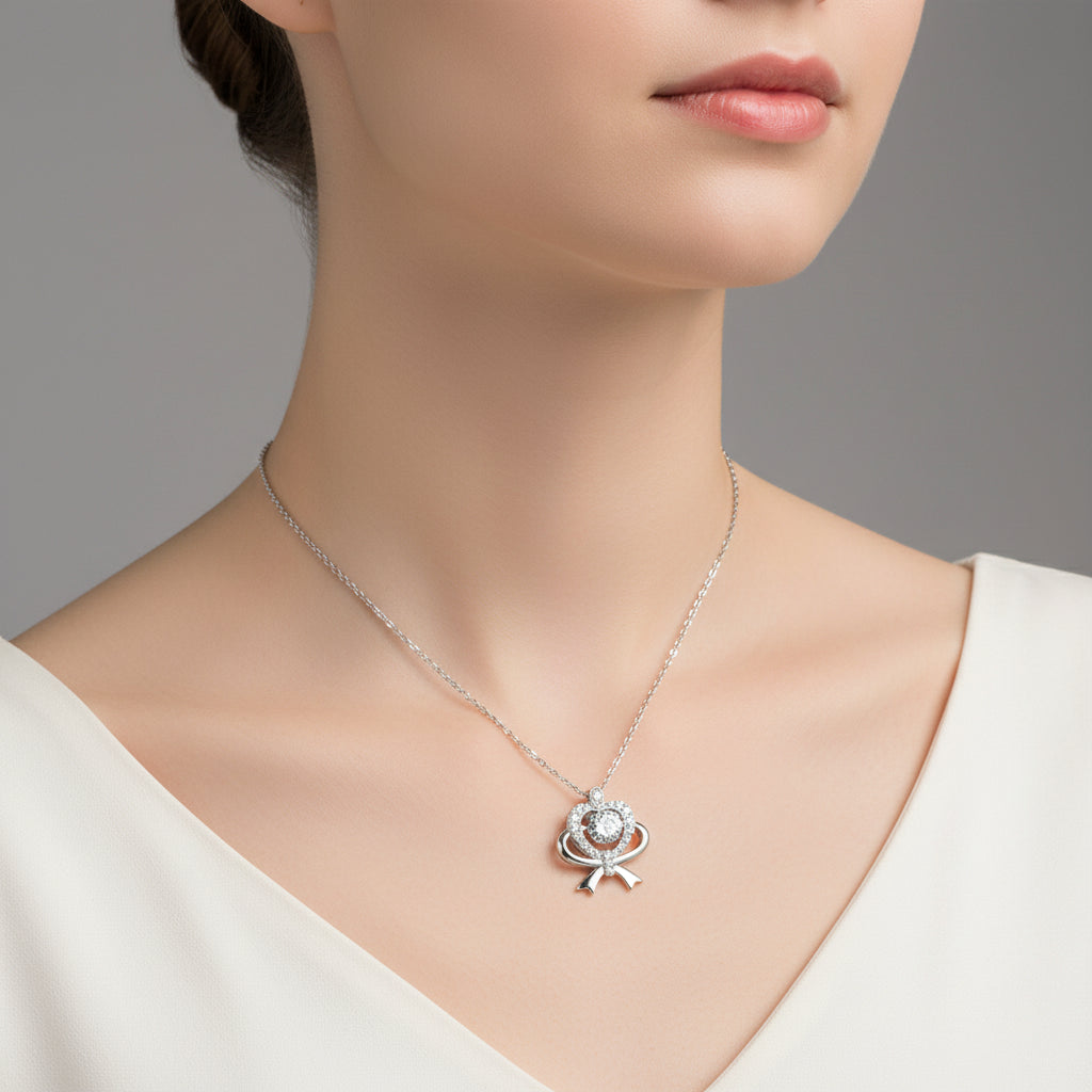 Silver necklace with a pendant on a model against a neutral background