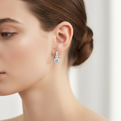 Close-up of a woman wearing a diamond earring with a blurred background