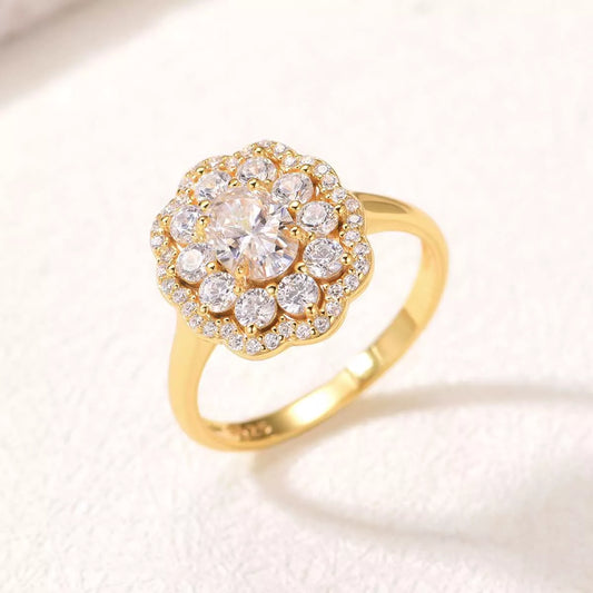 Gold ring with diamond-like stones on a light background