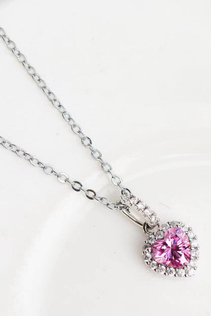 Necklace with a pink heart-shaped pendant on a white background