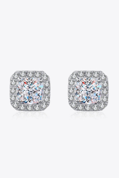 Pair of square-shaped earrings with clear gemstones on a white background