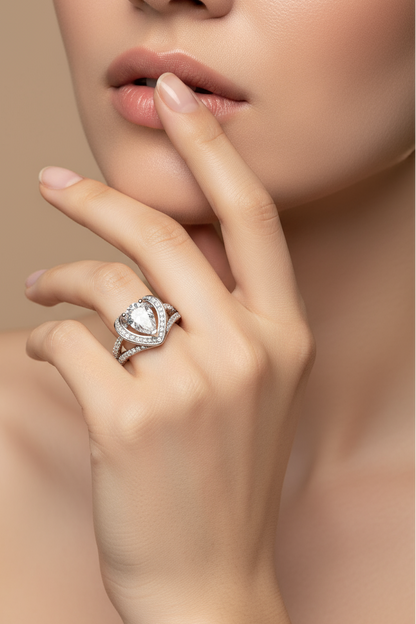 Close-up of a hand wearing a diamond ring with a soft background